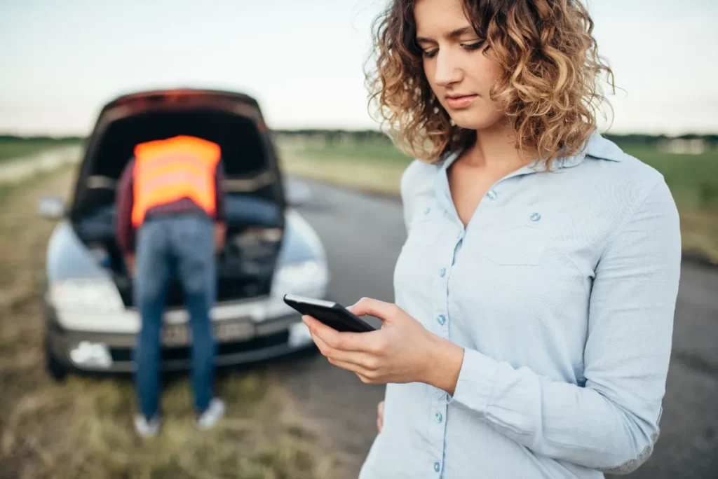 A woman calling a calling a roadside assistance.